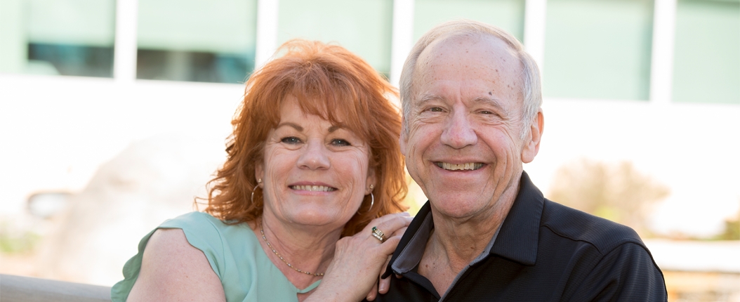 Patient chuck with wife smiling